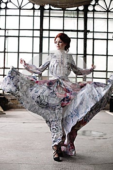 Elegance woman with flying dress in palace room