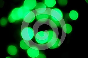 Elegant abstract green bokeh defocused lights dots background