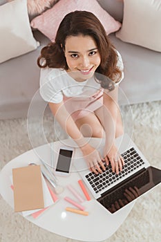 Elegant asian lady freelance worker typing on laptop computer replying message online shop customer service internet