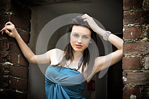 Elegant attractive young woman on threshold