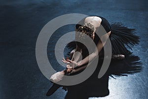 elegant ballet dancer in pointe shoes and black tutu