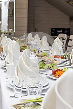 Elegant banquet table prepared for conference or party for guests.