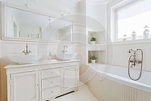 Elegant bathroom with white fittings photo