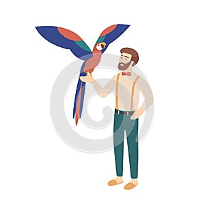Elegant bearded man holding parrot. Male character and his smart bird or avian. Owner of exotic tropical pet bird photo
