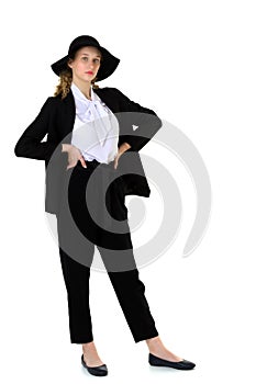 Elegant beautiful girl in a fashionable black suit