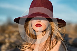 Elegant beautiful woman with red lips and hat photo