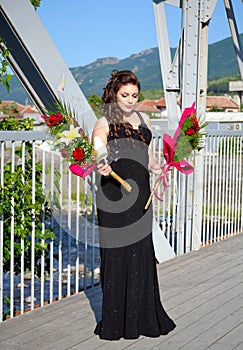 Elegant beauty prom girl with flowers Bulgaria