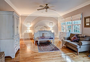 Elegant bedroom with wood floors and tasteful furniture
