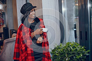 Elegant black girl in a cafe