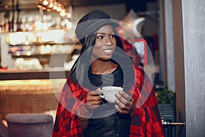 Elegant black girl in a cafe