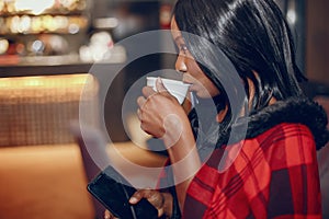 Elegant black girl in a cafe