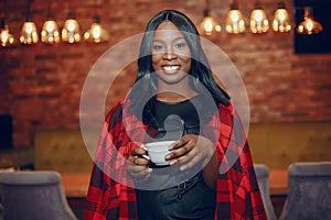 Elegant black girl in a cafe