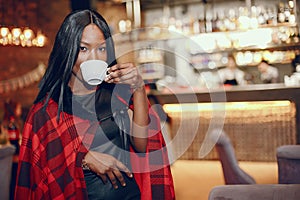 Elegant black girl in a cafe