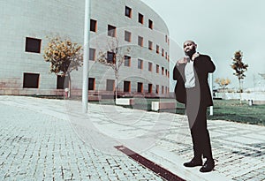 An elegant black man on the street photo