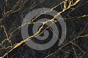Black marble texture with gold veins photo
