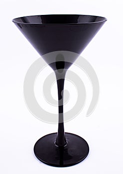 Elegant black martini glass isolated on white background