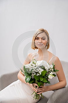 elegant and blonde bride in wedding