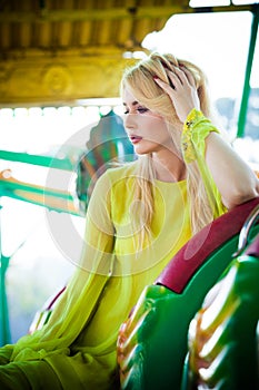 Elegant blonde fashion woman portrait in amusement park summer