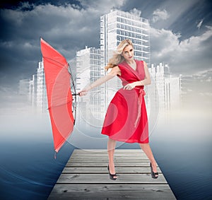 Elegant blonde holding umbrella photo