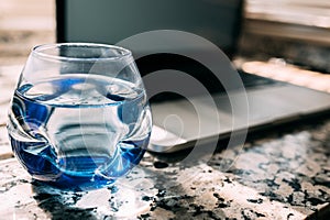 Elegant blue glass with water