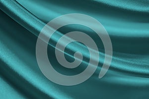 Elegant blue green background. Pale turquoise silk satin fabric. Shiny fabric flowing in waves. Close-up.