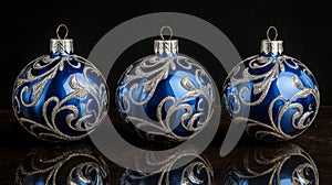 Elegant Blue and Silver Christmas Ornaments on Dark Background
