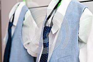 Elegant blue suits and shirts for two boys