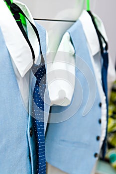 Elegant blue suits and shirts for two boys