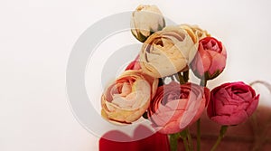Elegant bouquet of artificial peony flowers. Handmade flowers on the kitchen table. Flower arrangement. Decoration for