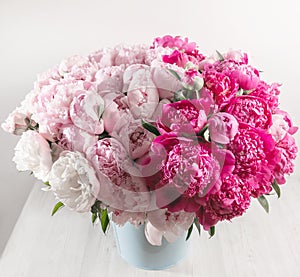 Elegant bouquet of a lot of peonies of pink color close up. Beautiful flower for any holiday. Lots of pretty and