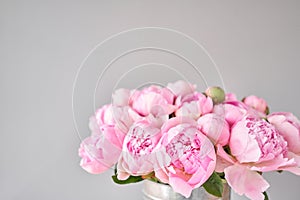 Elegant bouquet of a lot of peonies of pink color close up. Beautiful flower for any holiday. Lots of pretty and