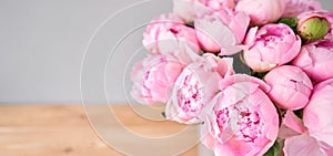 Elegant bouquet of a lot of peonies of pink color close up. Beautiful flower for any holiday. Lots of pretty and