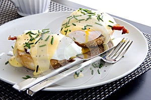 Elegant breakfast consists of eggs Benedict photo