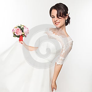 Elegant bride with beautiful wedding bouquet in a hands. wedding make-up and hairstyle concept