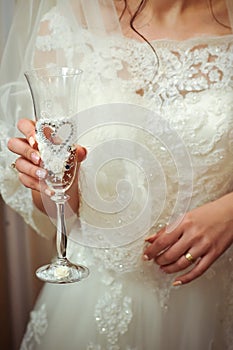 Elegant bride holding a champagne glass