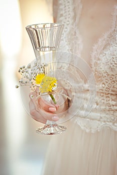 Elegant bride holding a champagne glass