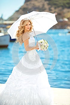 Elegant bride outdoor wedding portrait. Beautiful fiancee woman