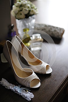 Elegant bride's shoes and garter