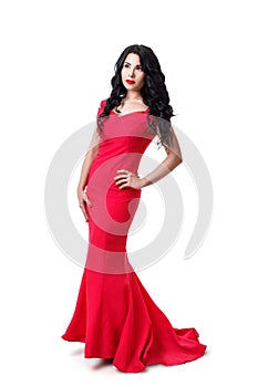 Elegant brunette girl in a black curly hair in a red evening dress. Isolated on white background