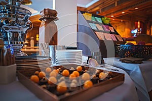 Elegant Buffet Spread with Fruits and Beverage Dispenser