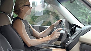 Elegant business lady learning how to drive car, trouble-free pregnancy, health