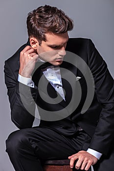 Elegant business man sitting on a chair while