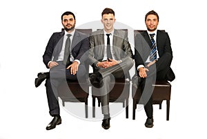 Elegant business men sitting chairs