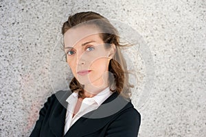 Elegant business woman with serious expression on face