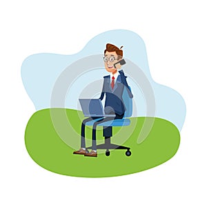 Elegant businessman calling with smartphone using laptop seated in chair