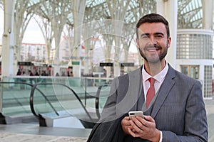 Elegant businessman holding a cellphone