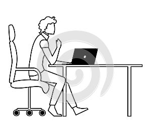 elegant businessman seated in office chair using laptop