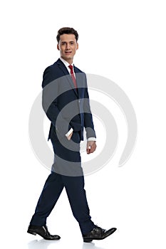 businessman walking and giving a big smile