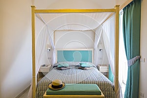 Elegant Canopy Bed in a Resort Room #1