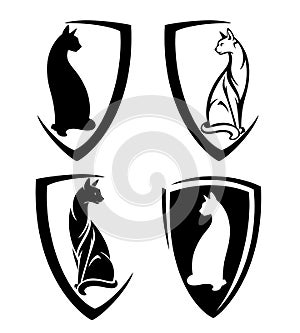 Elegant cat sitting in heraldic shield black and white vector emblem set